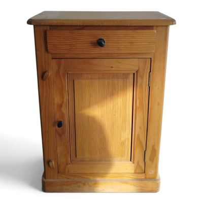 a small wooden cabinet with a drawer on top of it