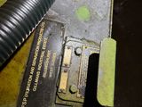 an image of a piece of metal with a hose sticking out of it