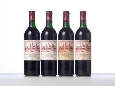 three bottles of wine are lined up on a table