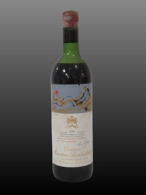 a close up of a bottle of wine on a black background