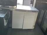 a picture of a kitchen with a sink and a refrigerator