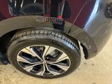 a close up of a car ' s tire with a sticker on it