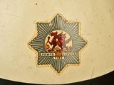 a picture of a fireman ' s hat with a badge on it