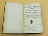 a book open on a table with a fleur de fleur on it