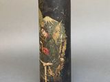 a black vase with a painting on it sitting on a table