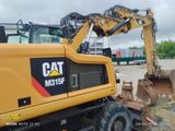 a yellow construction vehicle that is parked in a lot