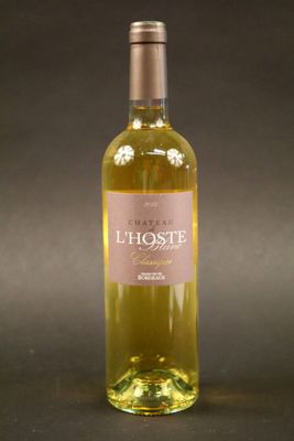 a bottle of wine that is sitting on a table