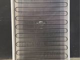 an image of a refrigerator with a heater on top of it