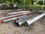 many pipes that are laying out in the dirt