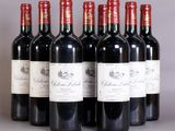 six bottles of red wine are lined up in a row