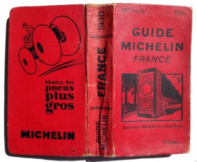 an old red book with a picture of a man in a boxing glove
