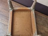 a wooden tray on a wooden table with a book