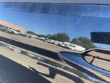 a reflection of a car on the side of the road