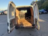a white van with its doors open in a parking lot