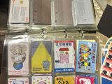 many cards in a case that are on a table