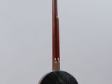 an image of a guitar hanging from a string on a wall