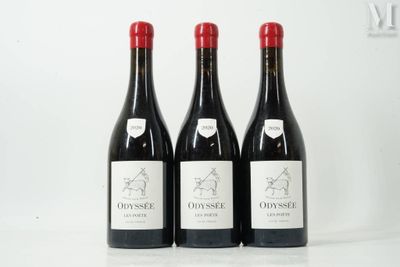 three bottles of red wine are lined up on a white surface