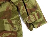 a close up of a camouflage jacket on a white background