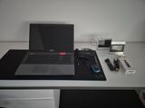 a laptop computer sitting on top of a white desk