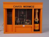 an orange box with a bottle of wine inside of it