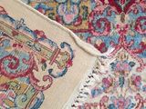 an image of a close up of a rug with a cat laying on it