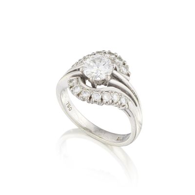 a diamond and platinum - plated ring, by van cleef