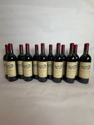 six bottles of wine are lined up on a table