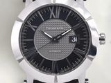 a close up of a watch on a white surface