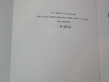 an open book with a black and white image of a man ' s face on it