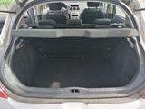the back of a car with its trunk open and the back seats down