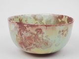 a bowl that is sitting on a white surface