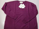 the sweater is purple and has a white tag on it