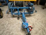 an image of a blue machine in a warehouse