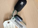 a car key with a tag attached to it