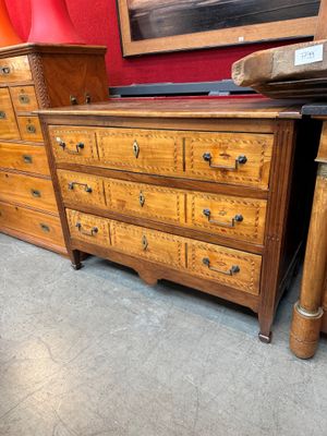 a dresser and a chest of drawers in a room