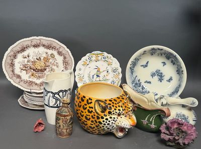 many different types of pottery on display on the table