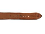 a close up of a brown leather watch strap on a white background