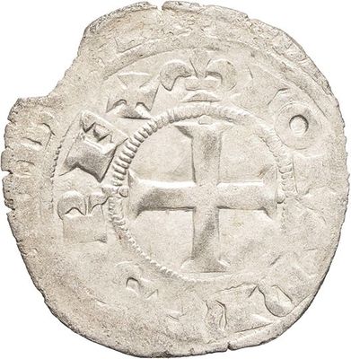 a close up of a coin with a cross on it