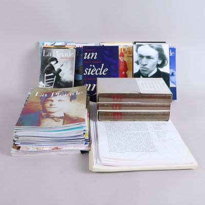 several books are stacked on top of each other on a table
