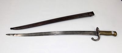 two old swords on a white surface with a black handle
