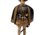 figurine représentant un homme avec un chapeau et une canne