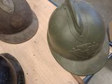 many helmets that are sitting on a table