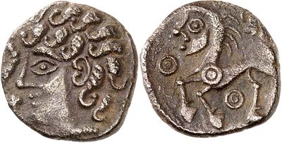 a silver coin with an image of a woman on it
