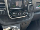 the interior of a car with a steering control and dashboard controls