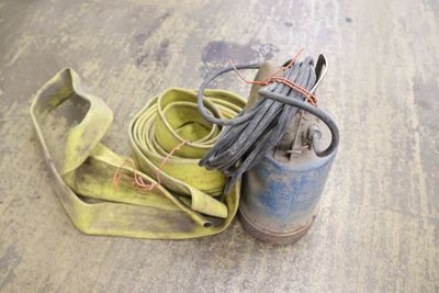 a pair of shoes and a hose on the floor