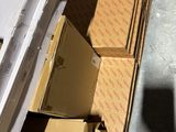 a cat that is sitting on the floor next to a box
