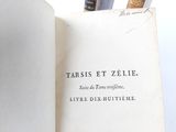 an open book with writing on it sitting on a table