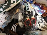 many pairs of shoes that are packed in a bag
