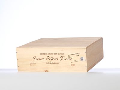 a wooden box that has a wine bottle inside of it
