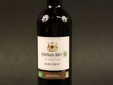 a picture of a bottle of red wine on a black background